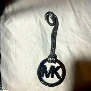 Michael Kors circle purse charm with gray leather strap